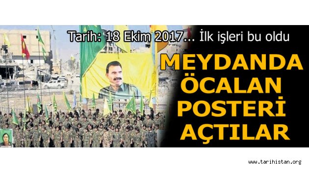 Rakka'da YPG bayrakları